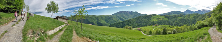 Scendendo sulla sterrata-segnavia 151 con vista su Prato Giugno e verso il Resegone, il Due Mani e le Grigne