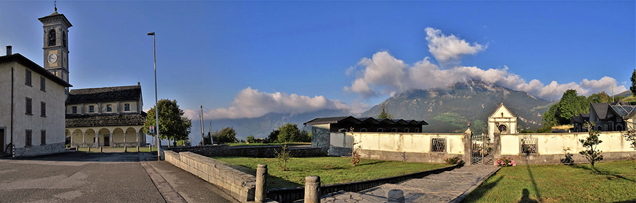 Chiesa di Fuipiano Valle Imagna con cimitero e vista in Resegone coperto da nebbie mattutine